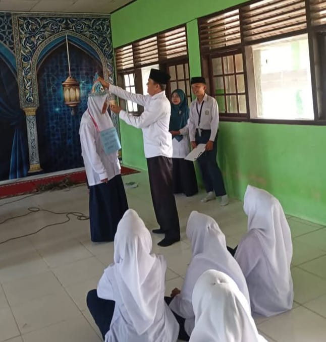 Hardenis, S.Pd.I, Kepala Madrasah MTs Babussalam Simandolak Resmi Membuka Kegiatan Masa Ta’aruf Murid Madrasah (MATAMUDA) Tahun Pelajaran 2026/2027